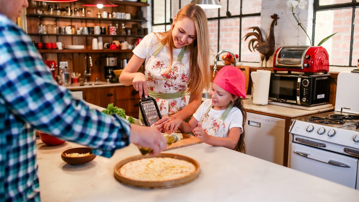 Mother and daughter bonding over meal preparation in a warm, cozy kitchen setting.